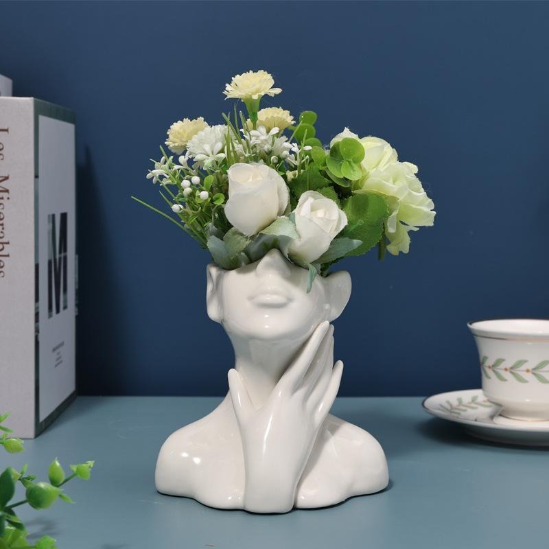 Ceramic art vase shaped like a Nordic human figure sculpture by Cavira, ideal for flowers, home decor, and shelf styling.