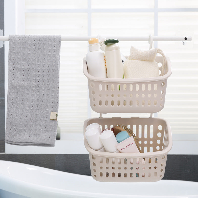 Plastic wall-mounted double hook storage basket by Cavira, ideal for organizing kitchen, bathroom, or bedroom items.