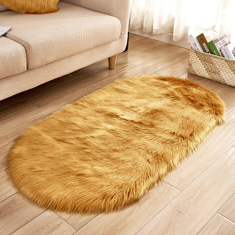 Oval acrylic plush rug by Cavira with soft wool pile, available in 14 colors and four sizes, ideal for bedroom or living room.