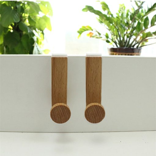 White iron and rubber wood wardrobe hook by Cavira, powder-coated for durability, perfect for bedroom or cabinet organization.