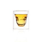 Double wall skull-shaped borosilicate glass by Cavira, designed for whiskey, beer, and cocktails, with a creative skull design.