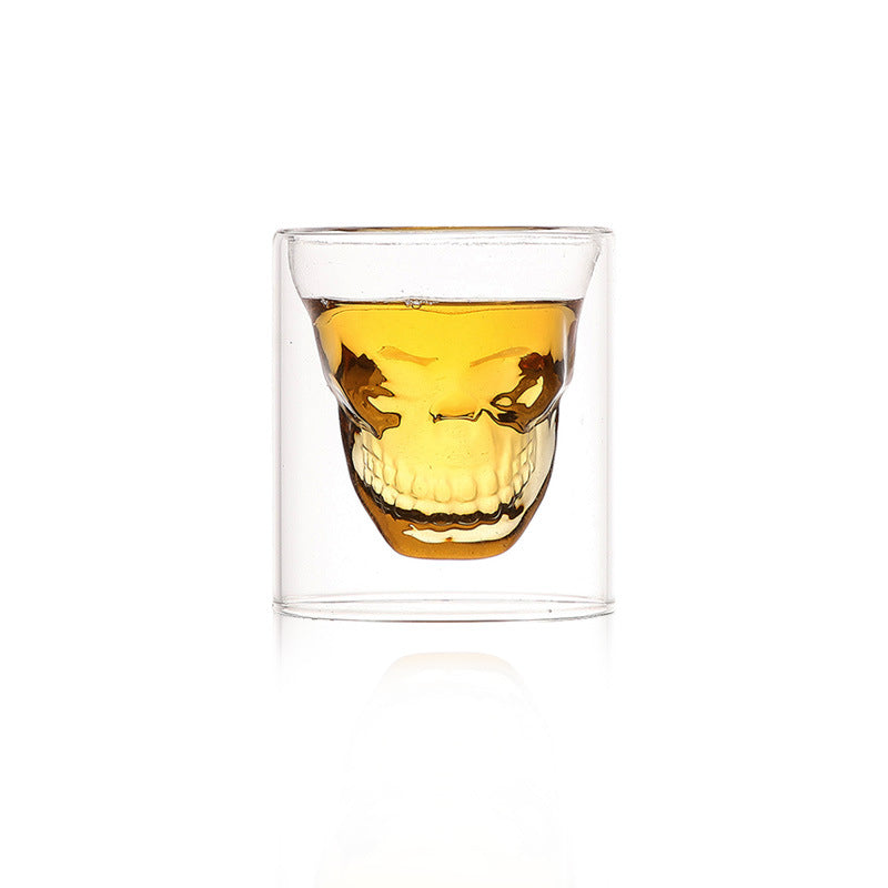Double wall skull-shaped borosilicate glass by Cavira, designed for whiskey, beer, and cocktails, with a creative skull design.