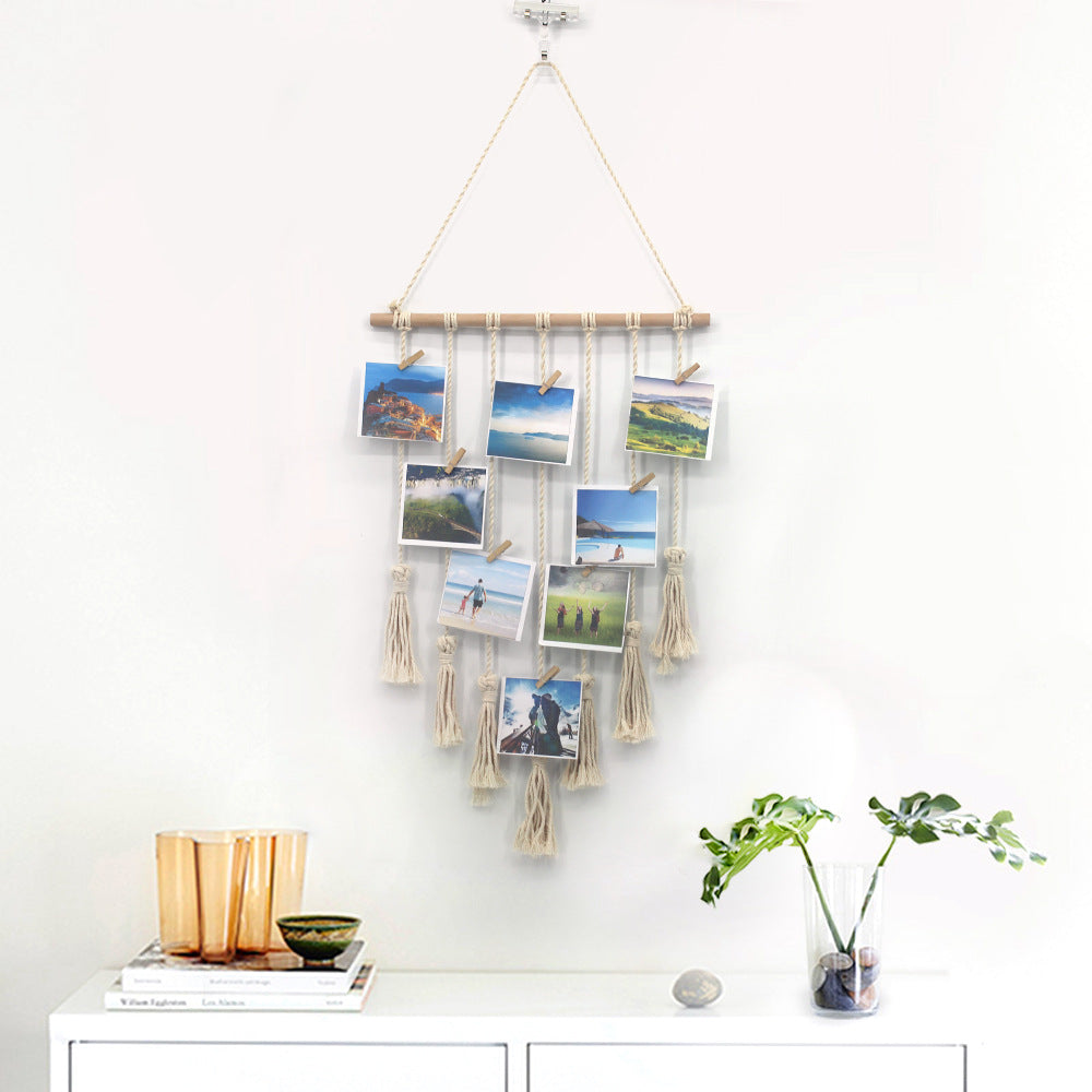 Handwoven cotton wall tapestry by Cavira with geometric design, wooden ring, and mini clips for bedroom or living room decor.