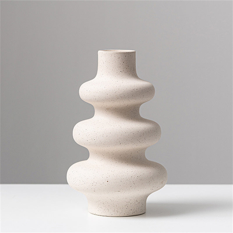 Frosted grain ceramic vase by Cavira with textured matte finish, ideal for flower arrangements and home decor.