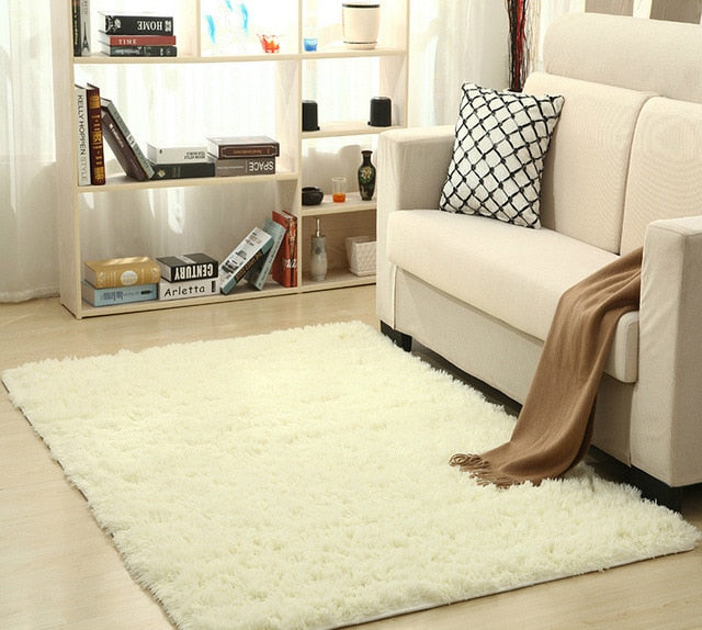 Cavira super soft shag area rug with silky polyester texture, ideal for living rooms, bedrooms, and nurseries.