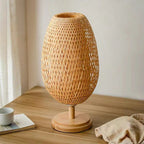 Bamboo woven LED desk lamp by Cavira with warm, tricolor, dimmable light and remote control, suitable for bedroom or living room.