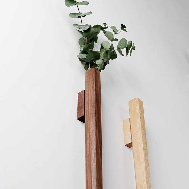 Solid wood wall hanging vase with glass insert by Cavira, ideal for hydroponic flowers and wall decor in living room or bedroom.