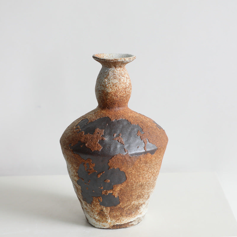Rustic handmade ceramic vase by Cavira with mottled glaze, ideal for flowers in Zen, Japandi, and Chinese-style home decor.
