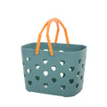 Portable hollow bath and storage basket by Cavira, made of PP plastic, in four colors for bathroom toiletries and laundry organization.