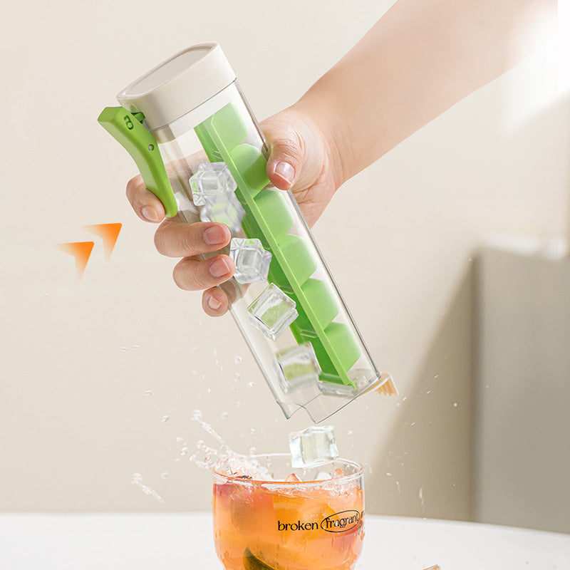 Large round ice ball mold by Cavira with orange and green food-grade plastic, ideal for whiskey, cocktails, and iced coffee.