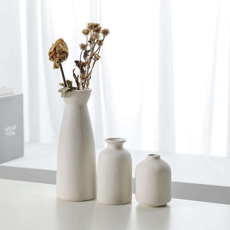 Set of three Cavira modern minimalist ceramic vases with sleek designs, perfect for decorative flowers in living rooms and home decor.