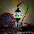 Moroccan mosaic glass table lamp by Cavira with stained glass and bronze iron, 22cm x 38cm, featuring 16 decorative designs.