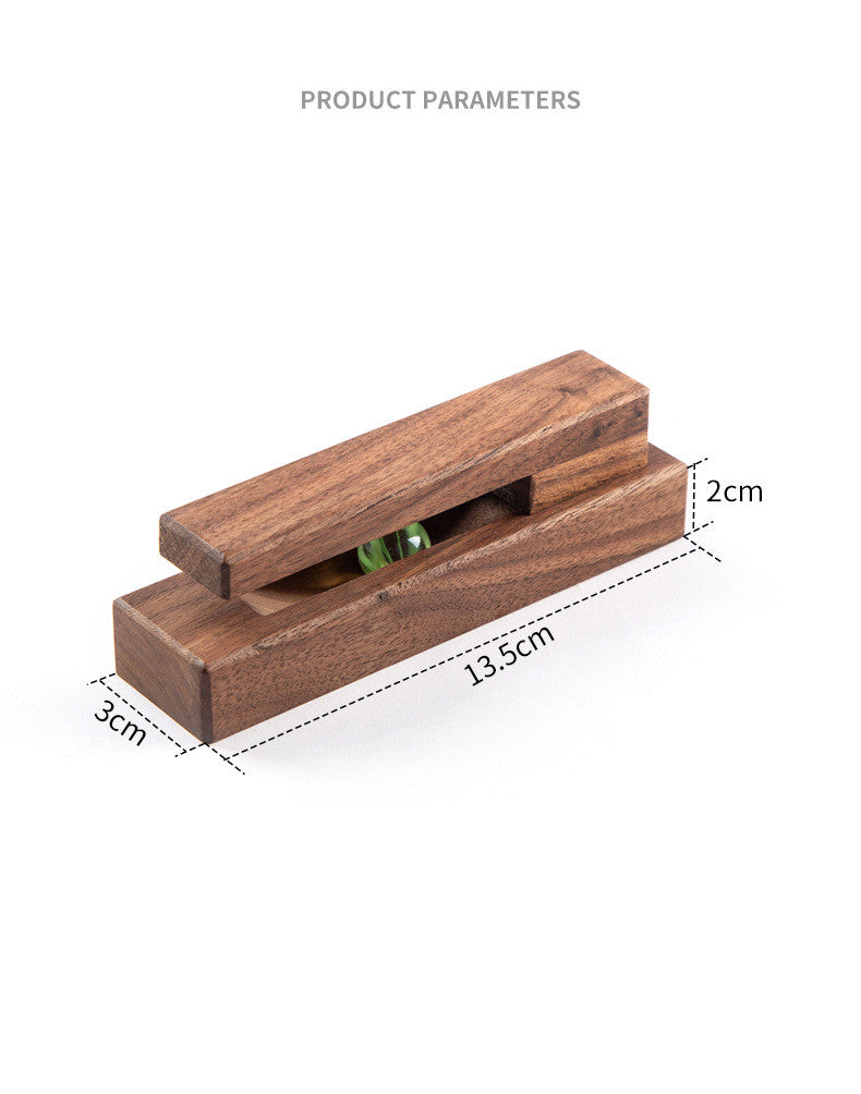 Black walnut and eucalyptus adhesive wooden single hook by Cavira, no-drill installation, suitable for bathroom, entryway, or bedroom.