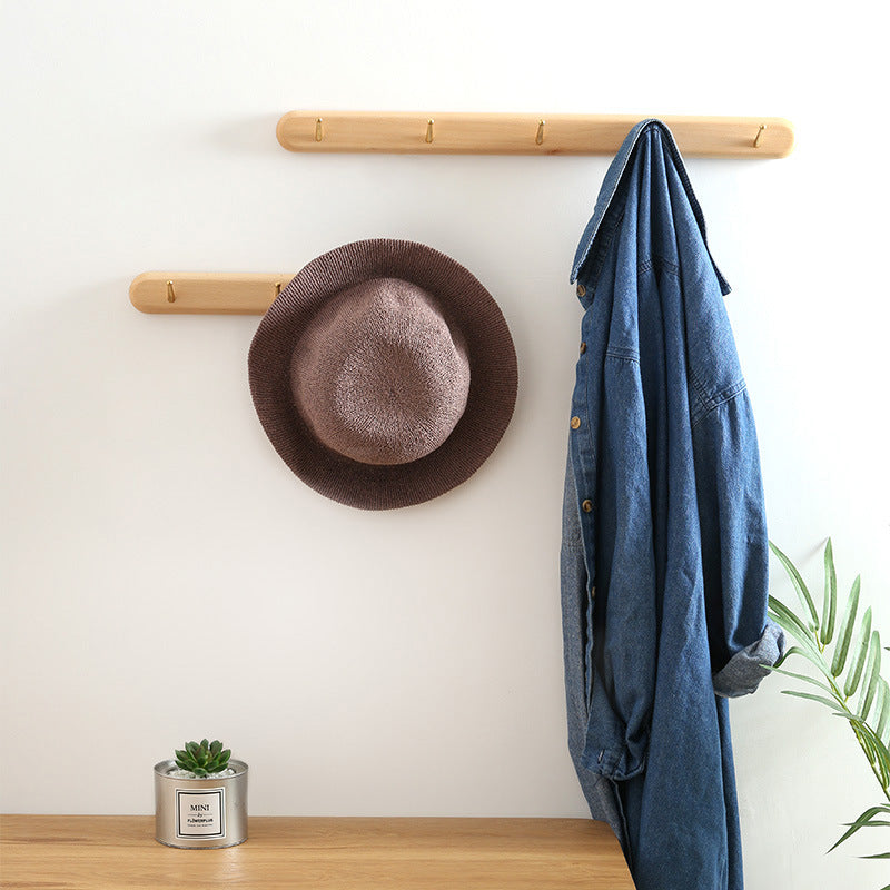 Beech wood baguette wall coat rack by Cavira with 2-5 hooks, ideal for entryways, hallways, and bedrooms, supports 10kg load