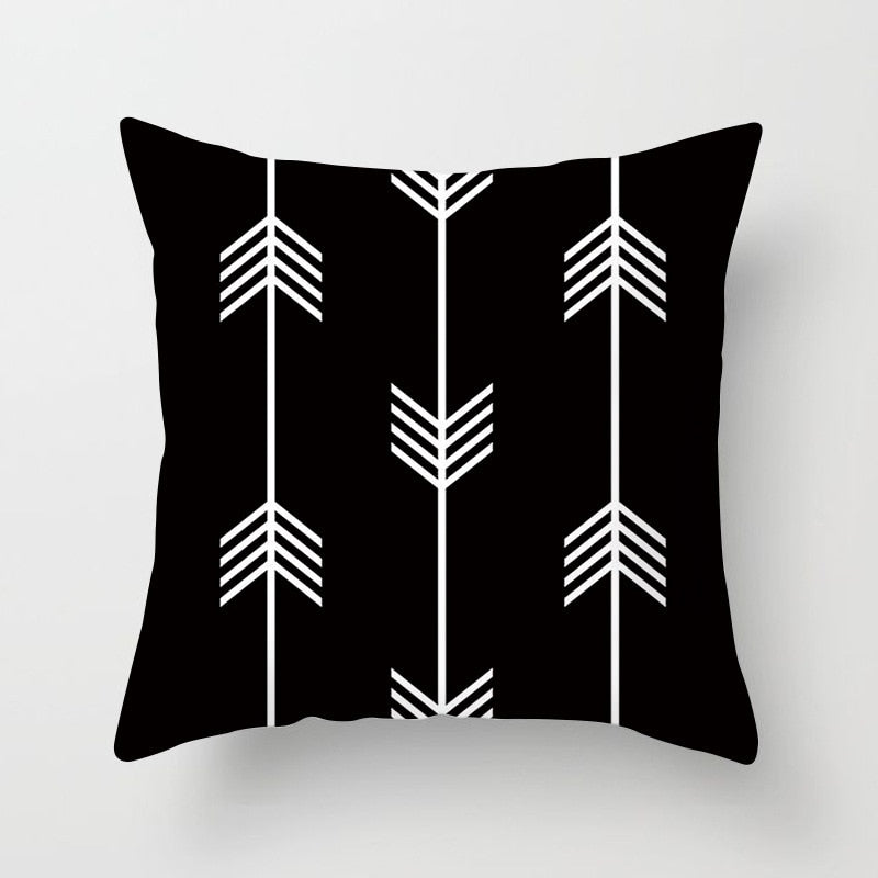 Black, white, and grey geometric jacquard knitted cushion cover by Cavira, perfect for sofas, chairs, and home decor.