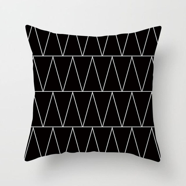 Black, white, and grey geometric jacquard knitted cushion cover by Cavira, featuring a stylish throw pillowcase for sofa and home decor.