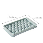 Blue and pink 33-grid round ice cube tray with lid from Cavira, stackable mold creating 33 ice balls for cocktails and cold drinks.