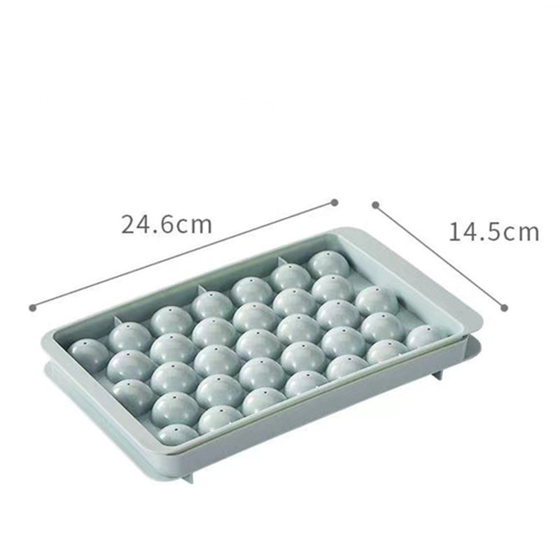 Blue and pink 33-grid round ice cube tray with lid from Cavira, stackable mold creating 33 ice balls for cocktails and cold drinks.