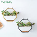 Octagonal white ceramic wall hanging planter with iron frame and bamboo tray, ideal for indoor plants, boho minimalist wall décor.