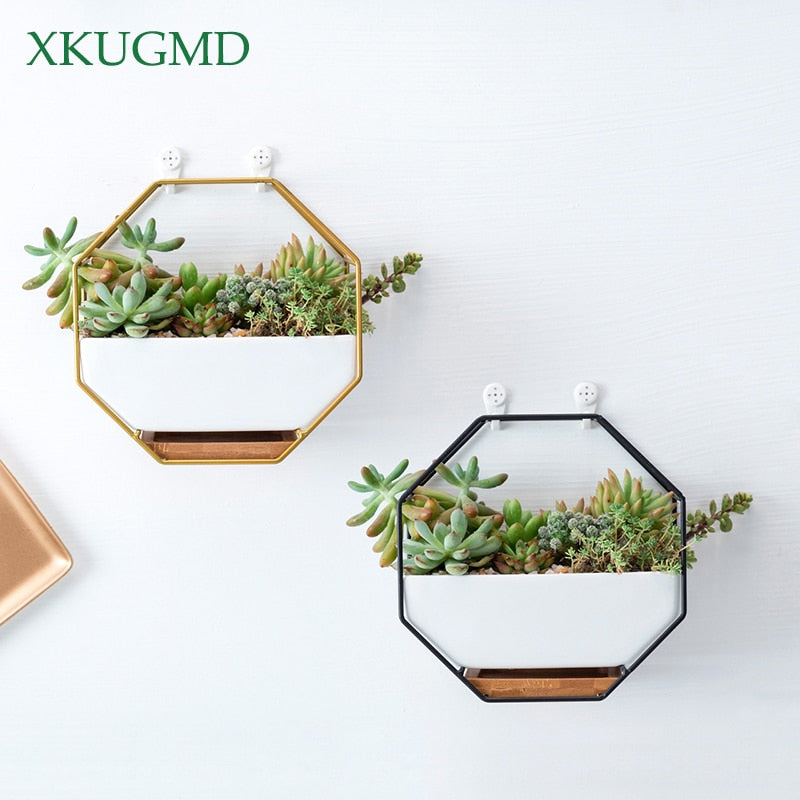 Octagonal white ceramic wall hanging planter with iron frame and bamboo tray, ideal for indoor plants, boho minimalist wall décor.