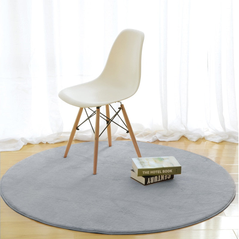 Cavira round area rug with non-slip base, soft memory foam feel in various colors and sizes, suitable for bedroom, living room, or hallway.