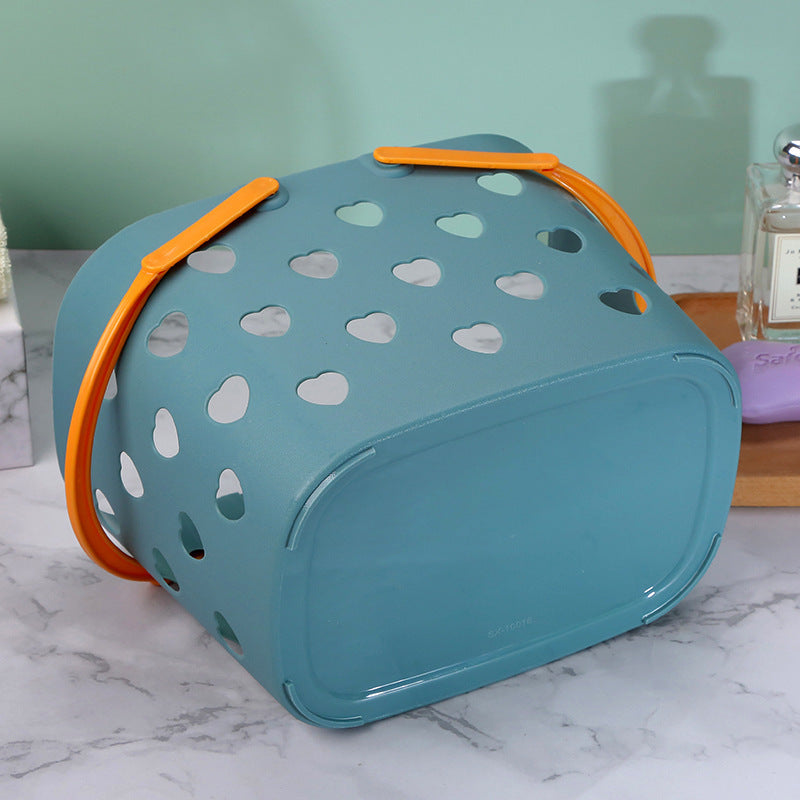 Portable hollow plastic bathroom storage basket by Cavira, suitable for toiletries and laundry in four colors.