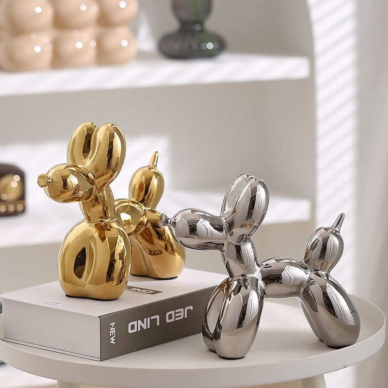 Ceramic balloon dog sculpture by Cavira, modern minimalist home decor ornament, 20x18cm, available in 8 colors on shelf or desk.