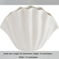 White porcelain ceramic vase by Cavira, modern minimalist hydroponic flower arrangement for home decor or gifting.