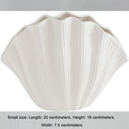 White porcelain ceramic vase by Cavira, modern minimalist hydroponic flower arrangement for home decor or gifting.
