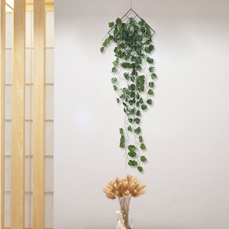 Faux green vine wall hanging with iron ring, boho style greenery décor for living room, bedroom, or study wall.