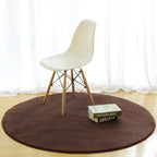 Cavira round area rug with non-slip base, soft memory foam feel, in various sizes and colors, suitable for bedroom or living room.