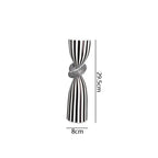 Black and white striped resin candle holder with modern irregular geometric design, ideal for home decor.