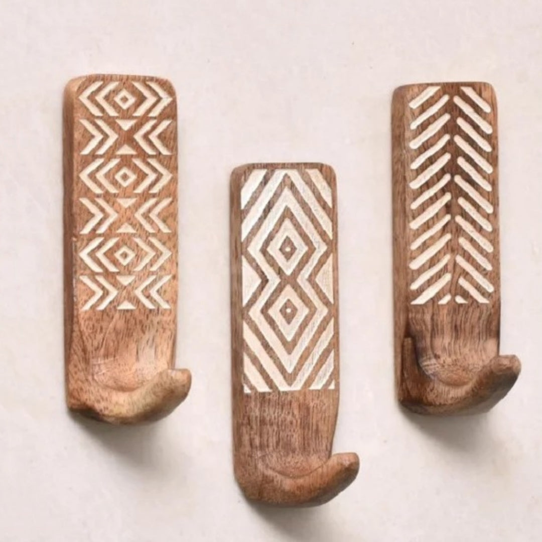 Set of three modern minimalist wood and bamboo hooks from Cavira, suitable for bedroom, entryway, or wardrobe.