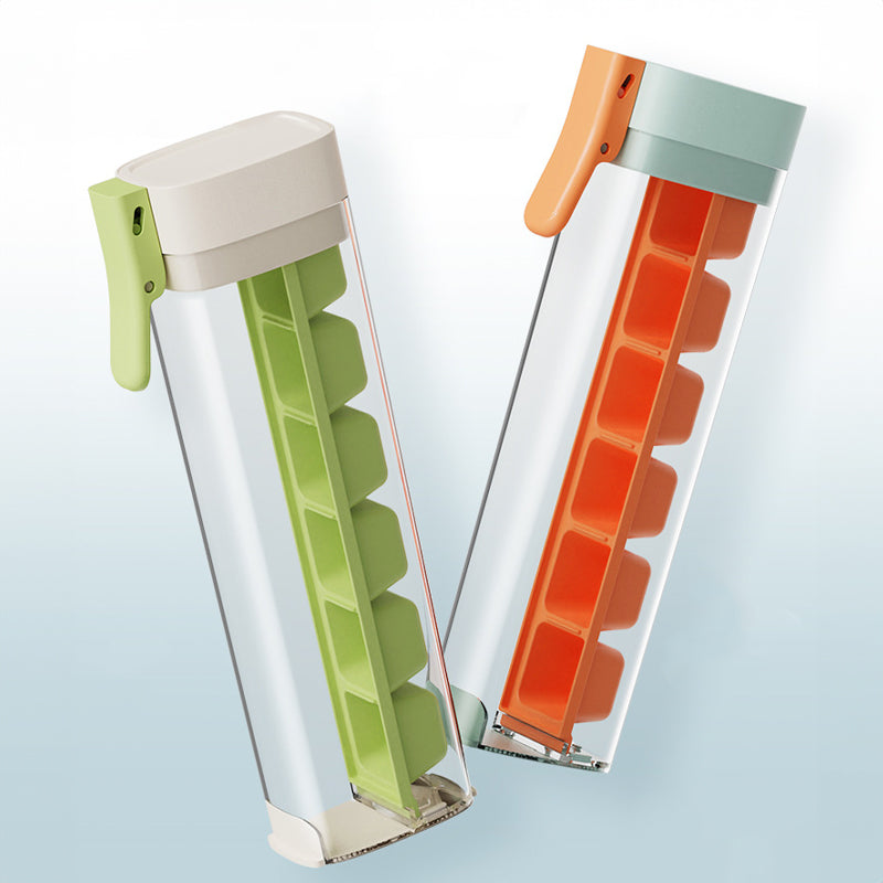 Large orange and green Cavira ice ball maker mold for creating slow-melt round ice spheres for whiskey and cocktails