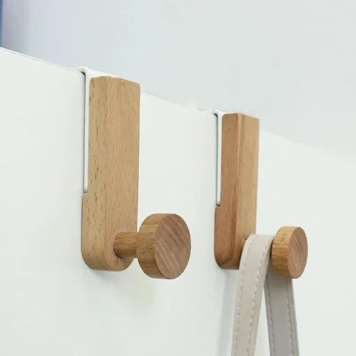 White iron and rubber wood wardrobe hook by Cavira, single or set of six, suitable for bedroom, cabinet, or wardrobe storage.
