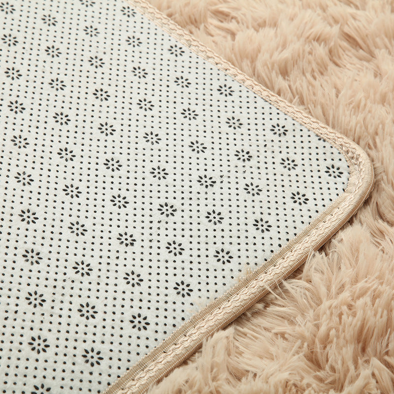 Cavira super soft shag area rug with silky polyester texture, ideal for living rooms, bedrooms, and nurseries.