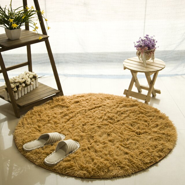 Cavira round shaggy faux fur rug with 4.5cm deep pile in various sizes and colors, featuring a non-slip latex base for bedroom or living room.