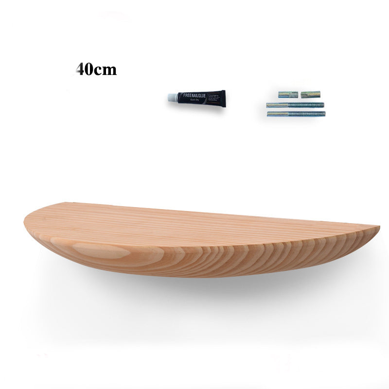 Cavira wooden semicircle wall shelf mounted on a wall, used for bedroom or living room decor and storage, natural wood finish.