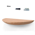 Cavira wooden semicircle wall shelf mounted on a wall, used for bedroom or living room decor and storage, natural wood finish.