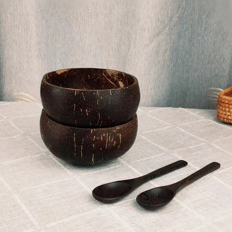 Handcrafted coconut shell bowl from eprolo with wooden utensils, ideal for breakfast, smoothies, or salads, eco-friendly and natural.