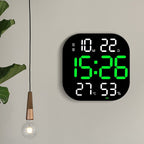Cavira LED acrylic smart wall clock with digital display showing time, temperature, and alarm settings in a modern living room setting.
