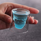 Cavira double wall skull-shaped borosilicate glass for whiskey, beer, and cocktails, featuring a detailed skull design.