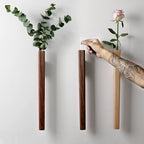 Cavira solid wood wall hanging vase with glass insert for hydroponic flowers, suitable for living room or bedroom decor.