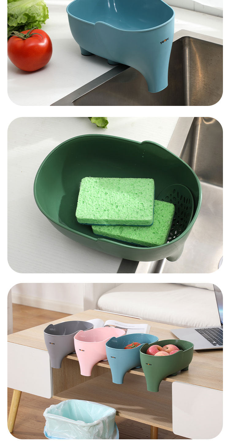 Cavira elephant-shaped drain basket in blue, used as a kitchen colander for washing fruits and vegetables.