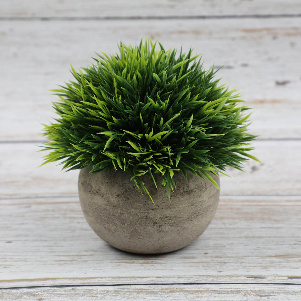 Artificial bonsai desktop plant in a semi-round pulp pot with faux grass and botanical arrangement, ideal for home or office decor.