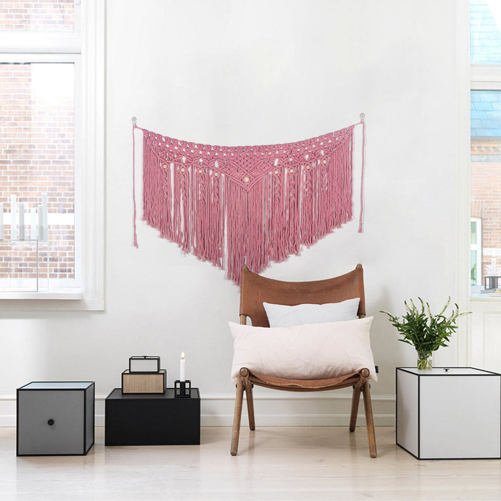 Pink bohemian cotton woven wall tapestry by Cavira, featuring a hanging basket weave design, ideal for bedroom decor or wedding backgrounds.