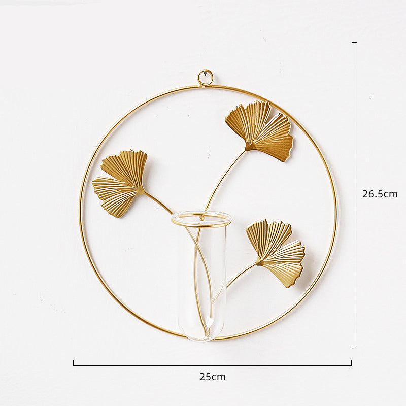 Golden iron wall-mounted hydroponic vase by Cavira with Scandinavian glass design, perfect for living room, bedroom, or home decor.