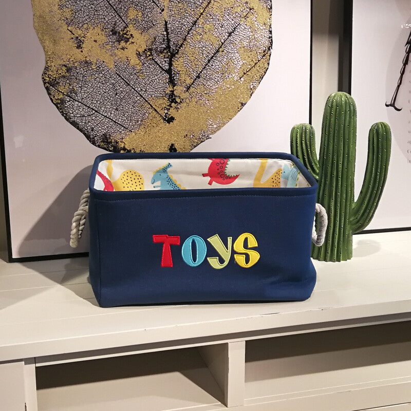 Cavira canvas folding dinosaur storage basket with embroidered cartoon dinosaur, ideal for kids' toys and stationery in bedroom or nursery