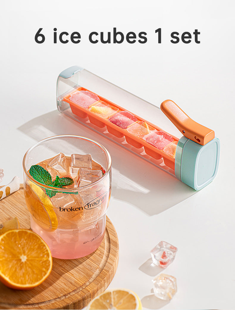 Large orange and green Cavira ice ball maker mold for whiskey, cocktails, and iced coffee, made of food-grade PP and PC.