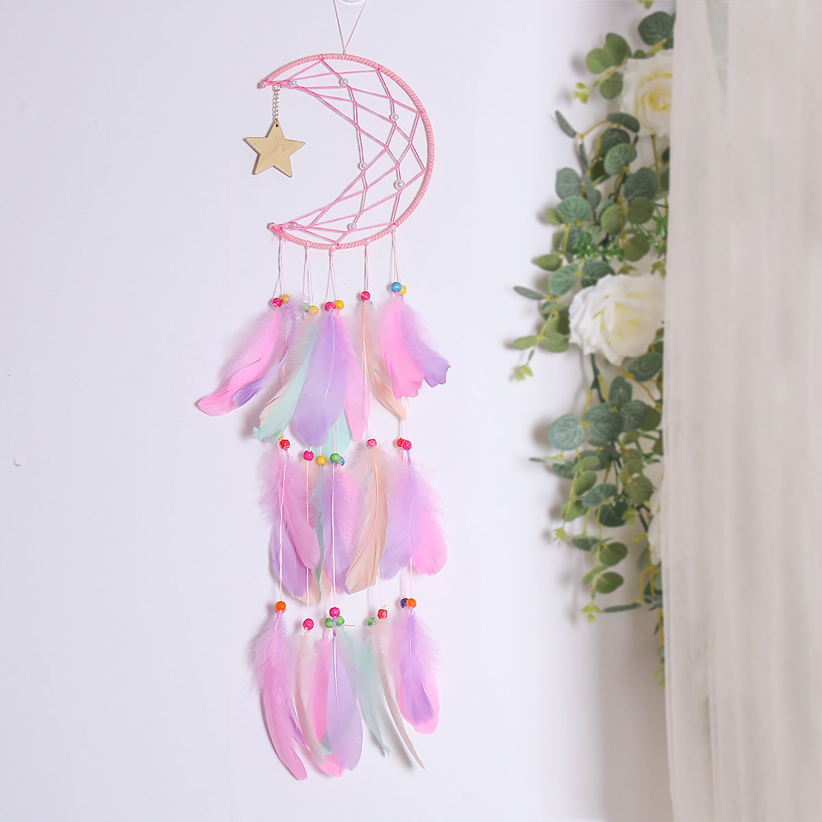 Crescent moon and star feather dream catcher wall hanging by Cavira, boho celestial decor for bedroom, nursery, or living room.